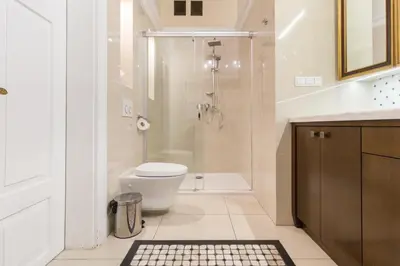 a bathroom with a shower and a toilet and a sink at MR 3 Apartments in Kraków