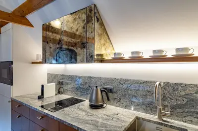 a kitchen with a sink and a counter top at MR 3 Apartments in Kraków