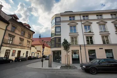 a car parked in front of a building on a street at Silver Apartment Old Jewish Quarter in Kraków
