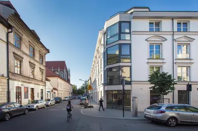 a city street with cars parked on the street at Silver Apartment Old Jewish Quarter in Kraków