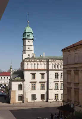 a building with a clock tower on top of it at City Point Apartment Old Jewish Quarter in Kraków