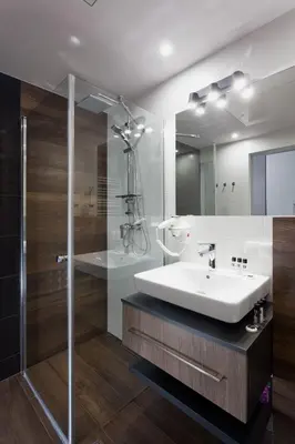a bathroom with a sink and a shower at City Point Apartment Old Jewish Quarter in Kraków