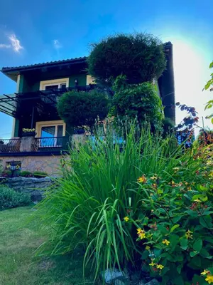 a house with a garden in front of it at Studio Roxi in Bachowice
