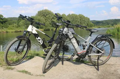 two bikes parked next to each other next to a river at Apartament Spytkowice - ENERGYLANDIA KRAKÓW OŚWIĘCIM WADOWICE in Spytkowice