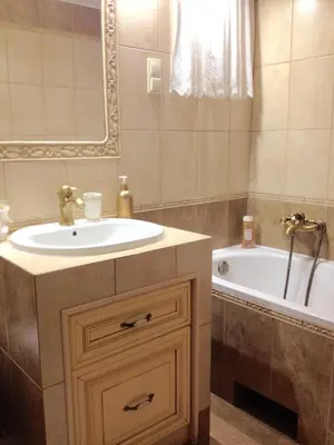a bathroom with a sink and a tub and a mirror at Dom Gościnny Krystyna - ENERGYLANDIA, SPYTKOWICE, ZATOR in Spytkowice
