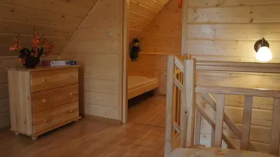 a small room with a bed with a red heart on it at domki w pewelce in Pewelka
