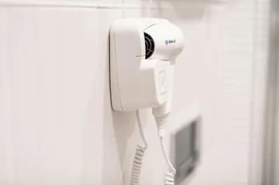 a phone is hanging on a wall at Lu Apartments in Oświęcim