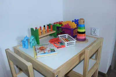 a table with some toys on top of it at Pokoje i Apartamenty na Szkolnej in Zator