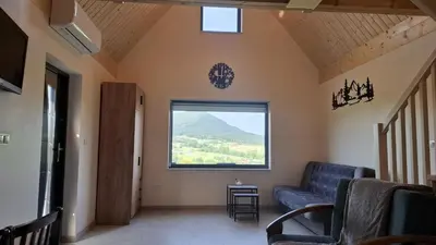a large house with solar panels on top of it at Agrorelax - Kasina Wielka in Kasina Wielka