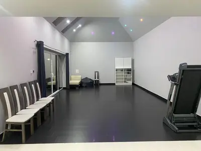 a room with chairs and a hair salon at Holiday home Limanowa in Limanowa