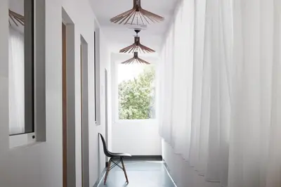 a white bathroom with a toilet and a sink at Polin House in Oświęcim