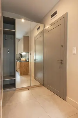a large glass door in a room with a kitchen at STAYPOLSKA in Oświęcim