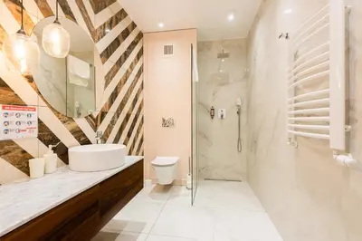 a bathroom with a sink and a shower at Apartment Old Town Halicka street by NEARTO in Kraków