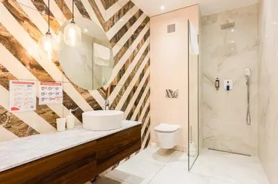 a bathroom with a sink and a shower at Apartment Old Town Halicka street by NEARTO in Kraków