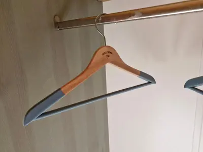 a wooden spoon is hanging from a door at Rodzinny Dom Wypoczynkowy Grzechynia Carchla in Grzechynia