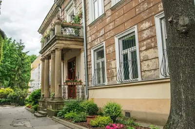 an alley in front of a brick building at Red Kurka Apartments in Kraków