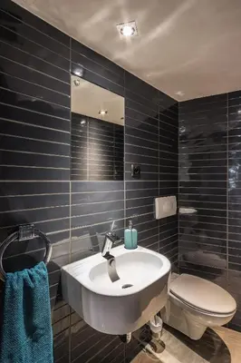 a bathroom with a sink and a toilet at Apartment Sare 11 in Kraków