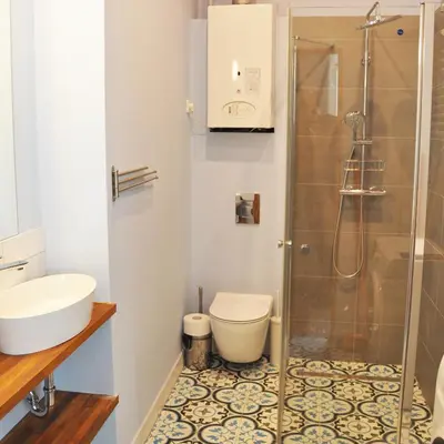 a bathroom with a shower and a toilet and a sink at Bożego Ciała by Homeprime in Kraków