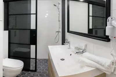 a bathroom with a sink and a toilet and a shower at Bożego Ciała by Homeprime in Kraków