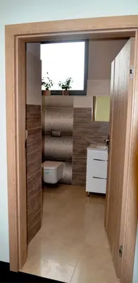 a bathroom with a toilet and a tub and a sink at 3Rooms in Kraków