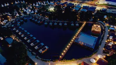 an overhead view of a pool at night at Western Camp Resort in Zator