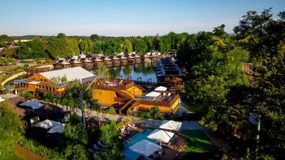 an aerial view of a resort on a river at Western Camp Resort in Zator