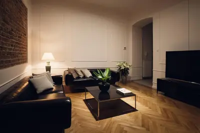 a living room with a couch and a coffee table at STRADOMSKA 2 APARTMENTS in Kraków