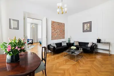 a living room with a couch and a table at STRADOMSKA 2 APARTMENTS in Kraków