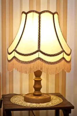a lamp sitting on top of a table at Da Vinci Apartment in Kraków