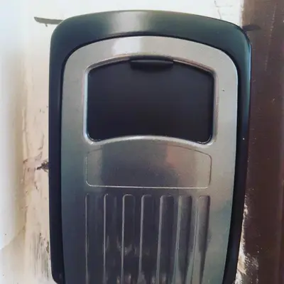 a close up of a cell phone on a wall at Da Vinci Apartment in Kraków