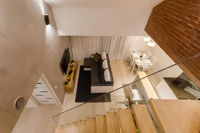 an overhead view of a living room with a couch at Central Penthouse with terrace in Kraków