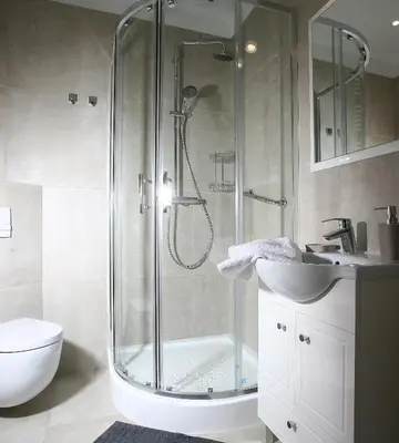 a bathroom with a shower and a toilet and a sink at AS Smart Apartment Old Town Krakow in Kraków