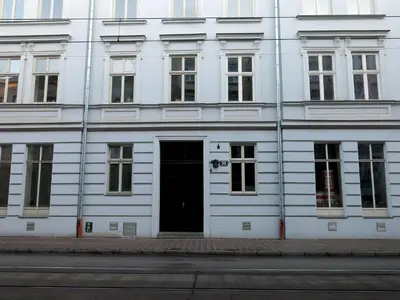 a white building with a door on the side of it at AS Smart Apartment Old Town Krakow in Kraków