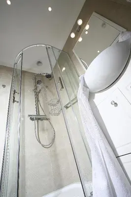 a glass shower stall in a bathroom with a shower at AS Smart Apartment Old Town Krakow in Kraków