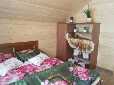 a bedroom with two beds and a teddy bear on a shelf at Gniewnik in Pcim