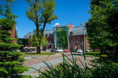 a street in a city with buildings and trees at Młyn Jacka Hotel & Spa in Wadowice