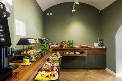 a buffet line with many different types of food at Home Aparthotel in Kraków