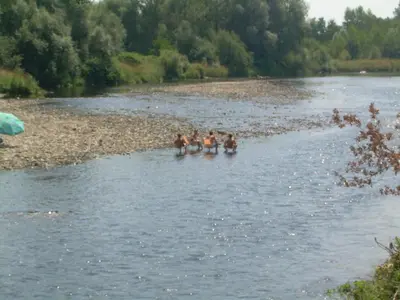 a group of people in the water on a river at Dworek Galicyjski in Oświęcim