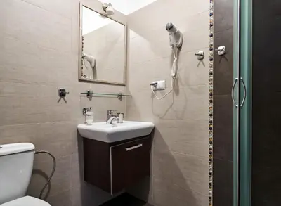 a hotel room with two beds and a window at Willa Pierrot in Oświęcim