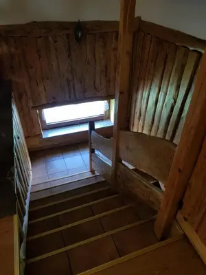 an empty room with stairs in a wooden cabin at Na Stawach in Stryszów