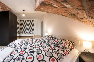 a bedroom with a large bed in a room at Fresh Apartments in Kraków