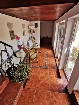 a view of a living room with a tile floor at Dom pod Tujami in Kraków