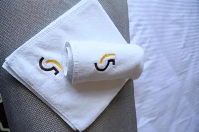 a close up of a white napkin with a smiley face at Apartamenty L5 in Kraków