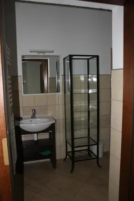 a bathroom with a sink and a mirror at Za Rabą in Myślenice