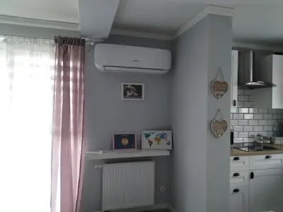 a kitchen with a window and a white ceiling at Apartament Julek klimatyzowany in Oświęcim