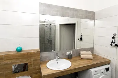 a bathroom with a sink and a mirror at Blue Apartment Old Town Air Condition p4you pl in Kraków
