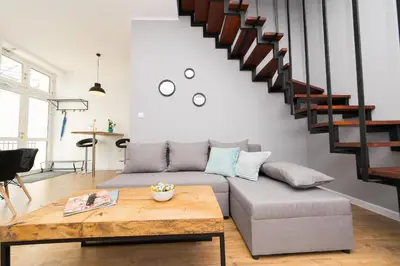 a living room with a couch and a table at Blue Apartment Old Town Air Condition p4you pl in Kraków
