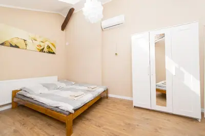 a bedroom with a bed and a mirror at Blue Apartment Old Town Air Condition p4you pl in Kraków
