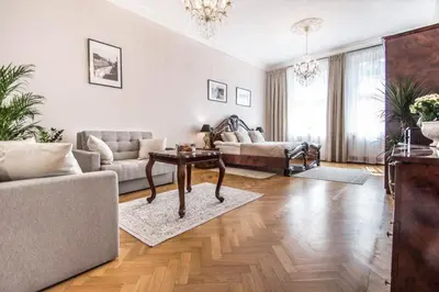 a living room with a couch and a table at Apartament w centrum Krakowa Krakowska 10 in Kraków