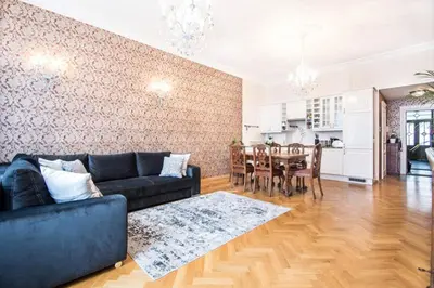 a living room with a couch and a dining room at Apartament w centrum Krakowa Krakowska 10 in Kraków
